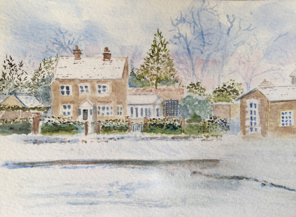 Chilli House across the snow-covered village pond.